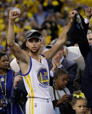 Golden State Warriors guard Stephen Curry celebrates after Game 5 of basketball's NBA Finals against the Cleveland Cavaliers in Oakland, Calif., Monday, June 12, 2017. The Warriors won 129-120 to win the NBA championship. (AP Photo/Marcio Jose Sanchez)