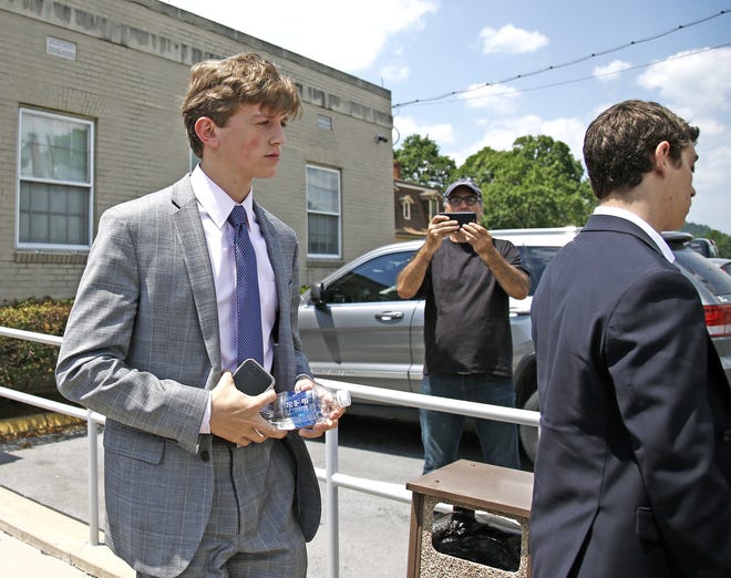 Parker Jax Yochim, left, walks out for a lunch break during his preliminary hearing on charges related to the hazing death of Timothy Piazza at the Penn State's Beta Theta Pi fraternity, at the Centre County Courthouse in Bellefonte, Pa., Monday, June 12, 2017. (AP Photo/Chris Knight)