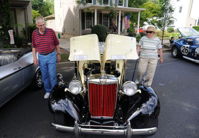 (FILE PHOTO) Erwin and Nancy Pietsch look at a 1953 MG during the Langhorne Classic Car Show in 2014. About 200 cars were on display at that year's event.