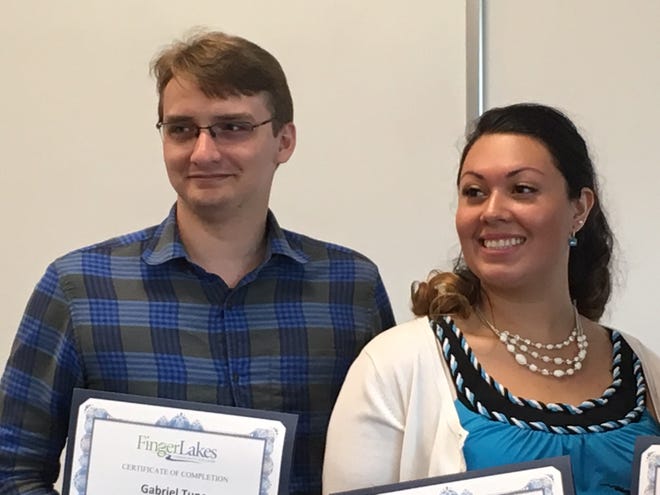 Gabriel Tune of Rushville and Kaeyla Erway of Fairport were among a small class of graduates Tuesday being recognized for completing the intensive 12-week Mechatronic Technology Program at Finger Lakes Community College. [DENISE CHAMPAGNE/MESSENGER POST MEDIA]