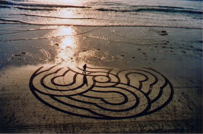 The artist Kirkos, aka Kirk Van Allyn, created one of his signature meditation labyrinths in the sand at Stonesteps Beach in Encinitas, CA.