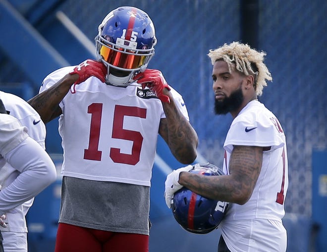 New York Giants' Odell Beckham, Jr., right, and Brandon Marshall participate in NFL practice in East Rutherford, N.J. on Tuesday. Beckham skipped voluntary workouts earlier in the month. [AP Photo/Seth Wenig]