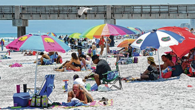 A recent sunny Saturday brought crowds to Jacksonville Beach. Tourism development leaders are working on new approaches to tout the city as a destination for leisure travelers, conventions and groups. (Bob Mack/Florida Times-Union)