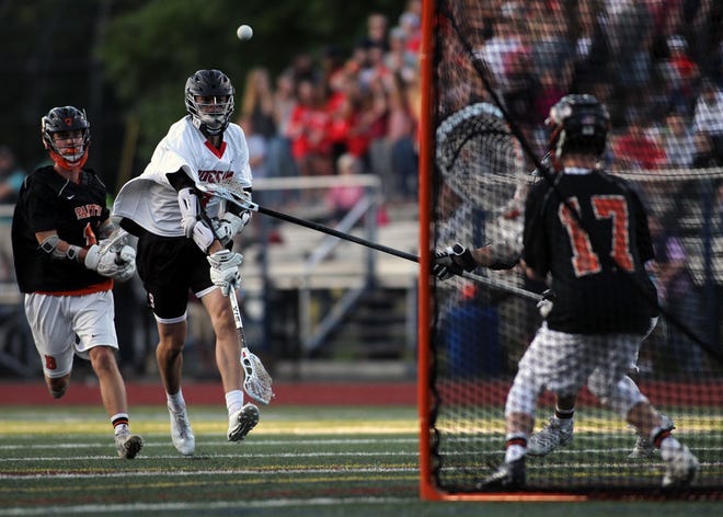 Jake Higgins scores on Beverly putting Hingham up 4-1 in the first quarter. [Wicked Local Staff Photo/Alyssa Stone]