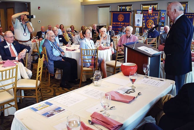 Past recipients of the Rotary Club of Oak Ridge's Vocational Service Award — including Sandy Richard, David Coffey, Louise McKown, Tom Row, Chuck Coutant, Paul Spray, Carroll Welch and Lawrence Hahn — listen to comments made by longtime community leader Mel Sturm, pictured far right, the most recent recipient of what is now known as the William T. Sergeant Vocational Service Award.