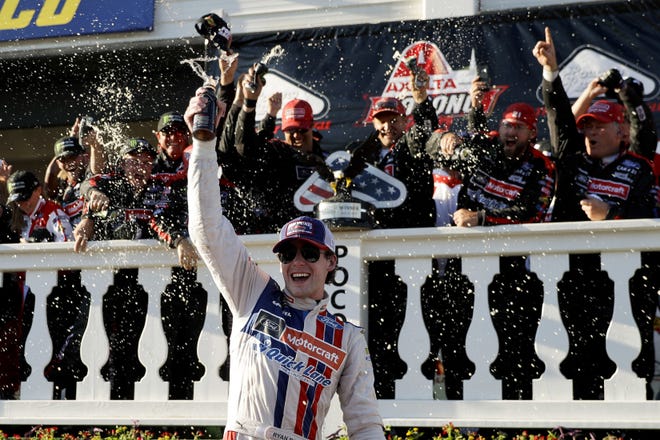Ryan Blaney celebrates in Victory Lane after winning the NASCAR Cup Series Pocono 400 on Sunday, the first Cup Series win of his career. [THE ASSOCIATED PRESS]
