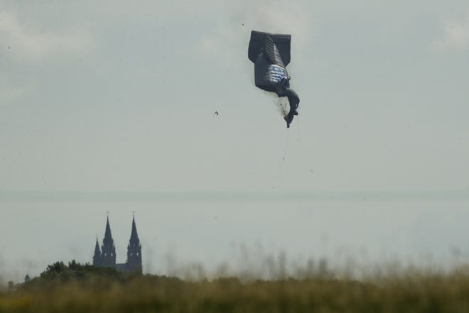 A blimp crashes during the first round of the U.S. Open golf tournament Thursday near Erin Hills in Erin, Wis. [AP Photo/Charlie Riedel]