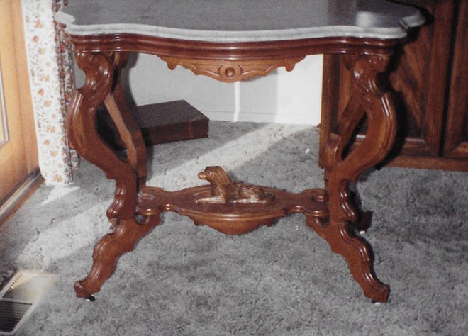 This Victorian table was made around 1860. The English pottery Wood & Barker was founded in 1897.