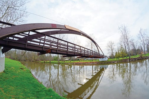 Blissfield village officials are going to change the design of the pedestrian bridge repairs to try to reduce concrete costs.