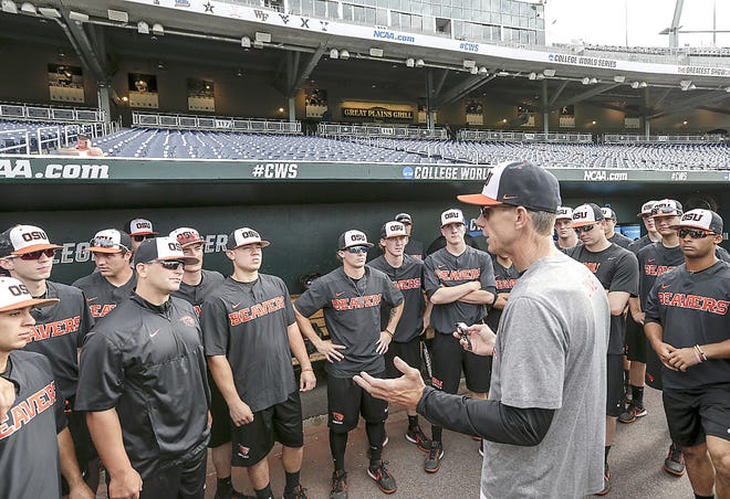 Oregon State coach Pat Casey addresses his players in the dugout before team practice Friday in Omaha, Nebraska.      

[Nati Harnik / AP]