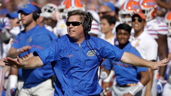 Florida football Jim McElwain has his contract extended through 2023 and given a raise in annual pay and performance bonuses by the school. (AP Photo/Chris O’Meara)