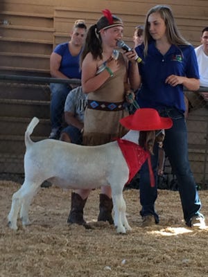 Ella Towell won the goat category at the AgFest costume contest Thursday evening, dressing as Pocahontas to her goat's cowboy. [LORI GILBERT/THE RECORD]
