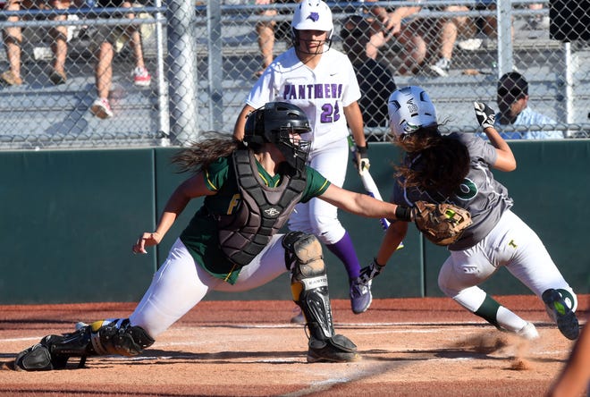 Tracy's Amanda Hernandez scores past the outstretched tag of Franklin catcher Cassie Webb at the High School All Star Baseball and Softball Classic Friday at Delta College.[CALIXTRO ROMIAS/THE RECORD]
