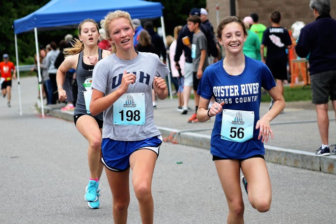 Durham's Sophie Sullivan, left, and Olivia Lenk were the second and third fastest females, respectively, in Saturday morning's ninth annual Bobcat Bolt 5K road race in Durham.