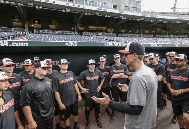 Oregon State coach Pat Casey addresses his players in the dugout before team practice in Omaha, Neb., Friday, June 16, 2017. Oregon State is on the cusp of joining the company of the greatest college baseball teams of all time. At 54-4, the Beavers enter the College World Series with the fewest losses of any team since 1982. (AP Photo/Nati Harnik)