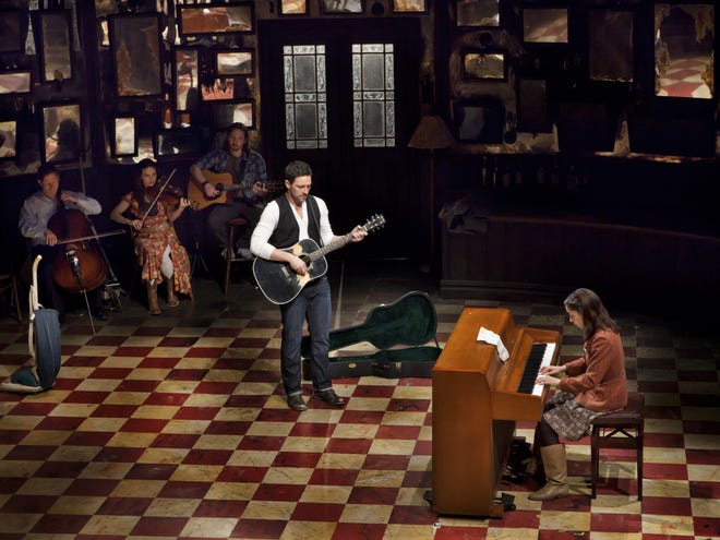 Steve Kazee, center, and Cristin Milioti, at the piano, in the Broadway production of “Once.” Florida Studio Theatre will stage its own production of the Tony Award-winning musical to open its 2017-18 season. [The New York Times / Sara Krulwich]