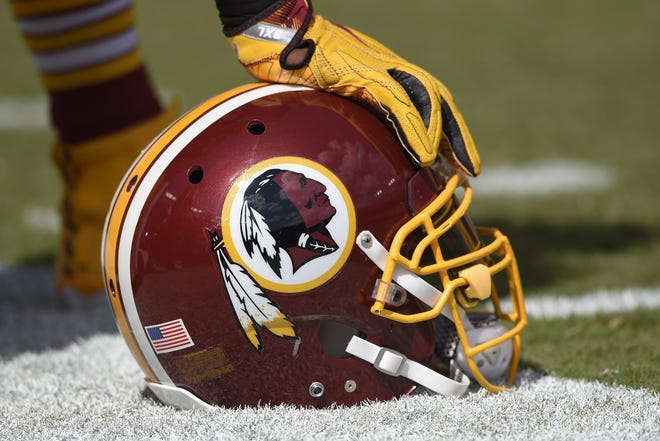 In this Sept. 18, 2016 file photo, a Washington Redskins helmet is seen on the sidelines during the first half of an NFL football game against the Dallas Cowboys in Landover, Md. The Supreme Court on Monday, June 19, 2017, struck down part of a law that bans offensive trademarks in a ruling that is expected to help the Washington Redskins in their legal fight over the team name. (AP Photo/Nick Wass, File)