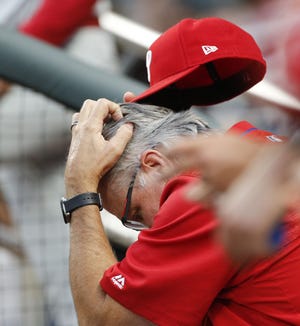 (File) Philadelphia Phillies manager Pete Mackanin scratches his head during the team's baseball game against the Atlanta Braves on Thursday, June 8, 2017, in Atlanta.