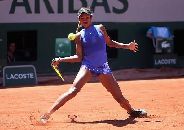 Bradenton's Whitney Osuigwe hits a forehand during the girls singles final match of the French Open against Claire Liu, also of the United States, on June 10 at Roland Garros in Paris. [PHOTO BY ALEX PANTLING / GETTY IMAGES]