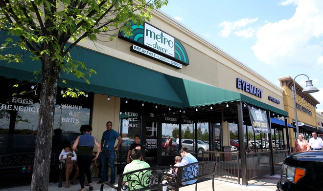 Guests wait outside to be seated at Metro Diner, located next door to Panera in Midtown Village in Tuscaloosa, Alabam, on April 13, 2017. [Gatehouse Media]
