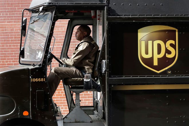 UPS driver takes his truck on a delivery route, in New York on Tuesday, May 9, 2017. [AP Photo/Mark Lennihan]