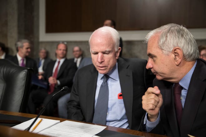 Senate Armed Services Committee Chairman John McCain, R-Ariz., left, confers with Sen. Jack Reed, D-R.I., the ranking member, at the start of a hearing at the Capitol in Washington, Tuesday, June 20, 2017. (AP Photo/J. Scott Applewhite)