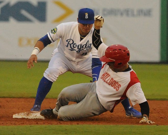 Michael Garvey of the Kernersville Bulldogs is safe at second base as Burlington Royals second baseman Jose Marquez applies a tag during Tuesday night's exhibition game at Burlington Athletic Stadium.