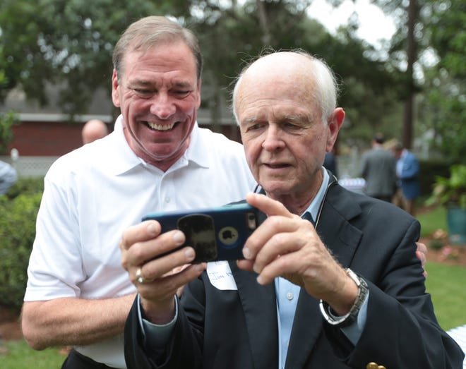 U.S. Rep. Neal Dunn stops for a selfie with Jim Moody on Monday at a fundraiser held by Allan Bense. [PATTI BLAKE/THE NEWS HERALD]