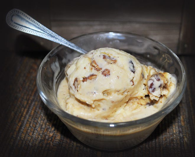 Toasted pecans in a caramel sauce blend with vanilla custard in a rich, creamy butter pecan ice cream.