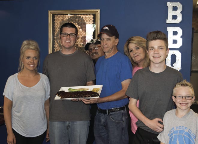 The family behind Pueblo West's Adams Ribs: (L-R) Owners Trista and Mike Adams, longtime cook Don Cunningham, original owners Dan and Susan Adams, and Trista and Mike's sons, Jordan and Aiden.