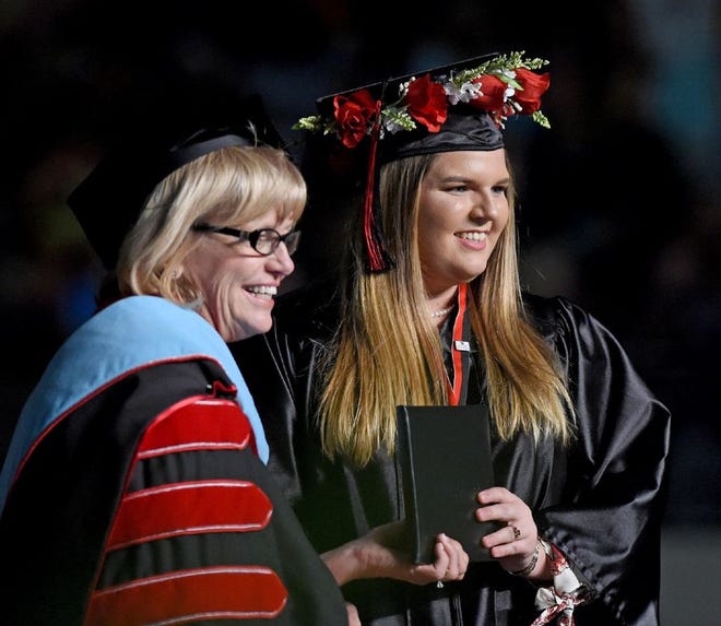 Heather Hill has her picture taken with President Eileen Holden during Polk State College's 116th Commencement at The Lakeland Center in Lakeland, Fl on Thursday May 4, 2017.