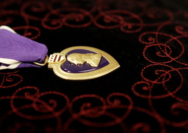 A bill passed by the state Senate on Tuesday would make it a third-degree misdemeanor for anyone to economically benefit from lying about their military service or receiving decorations or medals, such as the Purple Heart Medal, shown here, given to U.S. service members wounded in combat.