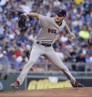 Boston pitcher Chris Sale allowed three runs on four hits while striking out 10 in leading the Red Sox to an 8-3 victory Tuesday. [Charlie Riedel/The Associated Press]