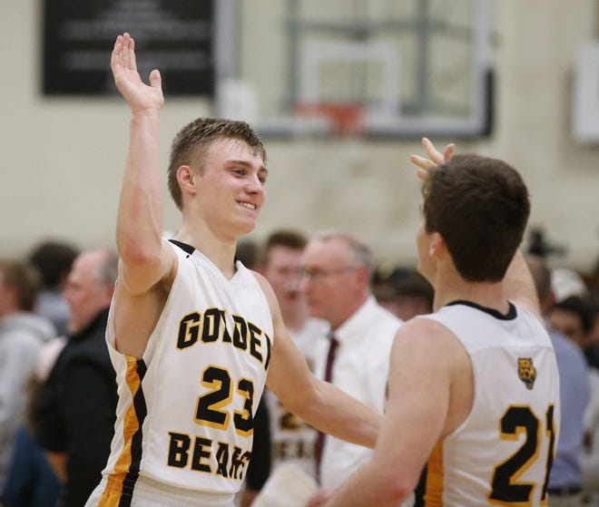 Dane Goodwin (23) and Will Grabovac (21) of Upper Arlington celebrate following a 68-67 win over Westerville South on January 24, 2017. (Barbara J. Perenic/The Columbus Dispatch)