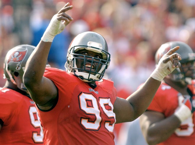 FILE - In this Jan. 12, 2003, file photo, Tampa Bay Buccaneers' Warren Sapp tries to get the crowd going during the third quarter of the NFC divisional NFL football playoff game against the San Francisco 49ers in Tampa, Fla. Sapp is donating his brain for medical research. Sapp announced on social media Tuesday, June 20, 2017, that his brain will go to the Concussion Legacy Foundation after his death. The 44-year-old said in a statement that he's started to feel the effects of the many hits he took during his 13-year NFL career. He said he's specifically become concerned about his memory. Sapp said he hopes his donation can help prevent concussions and permanent brain damage for future football players. (AP Photo/Steve Nesius, File)