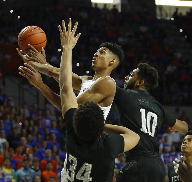 Florida junior forward Devin Robinson (1) had his best season last year, averaging 11.1 points per contest while hitting shots at a career-high 39.1 percent clip from beyond the arc. [Brad McClenny/Staff photographer/File]