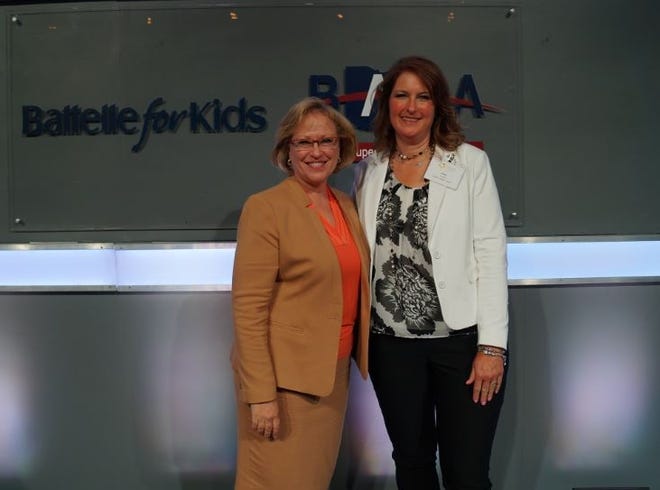 Indian Valley Local Schools teacher Patty Couts recently was recognized by Battelle for Kids as a distinguished educator for tremendous impact on students, colleagues and the community. Pictured, from left: Battelle for Kids President and CEO Karen K. Garza and Couts. PHOTO PROVIDED