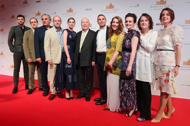 The cast and producers of Downton Abbey on the red carpet at the launch of an exhibition about the television series at the Marina Bay Sands on June 21, 2017, in Singapore. [AP Photo/Joseph Nair]