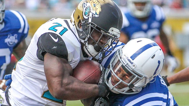 Jaguars running back Justin Forsett is tackled by Colts safety Antoine Bethea during the first half of a game Sept. 29, 2013, in Jacksonville. (Florida Times-Union, file)