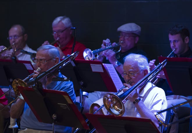The horn section plays during a Kingdom of the Sun Band practice in September 2015 at the Marion Technical Institute auditorium. The band will play on for at least one more year thanks to a $10,000 community donation.[Doug Engle/Staff photographer/file]