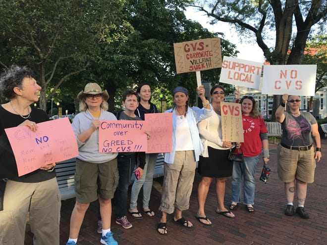 Protesters outside Town Hall before the zoning board of appeals heard CVS’s case last Thursday. Photo Katy Ward