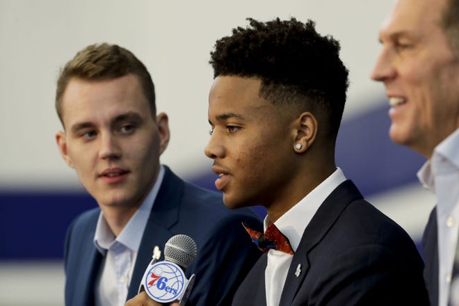 Sixers draft picks Markelle Fultz (center) and Anzejs Pasecniks (left) are introduced to the Philadelphia media Friday as team president of basketball operations Bryan Colangelo looks on.