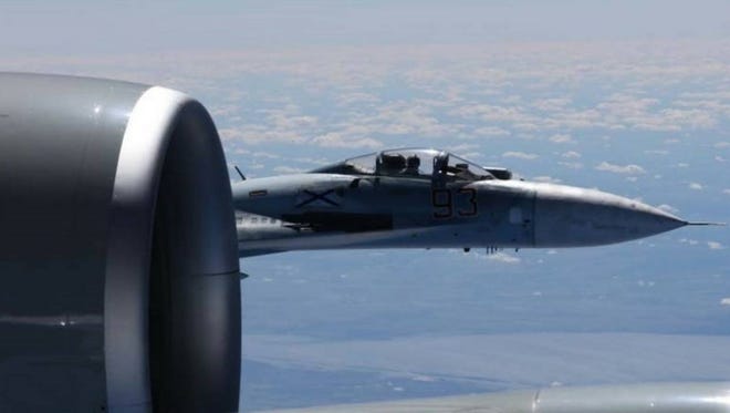 The photographs released Friday june 23, 2017 show the Russian SU-27 coming so close to the wing of the U.S. RC-135U the Russian pilot can be seen sitting in the cockpit in some images. ( Master Sgt Charles Larkin Snr/U.S. European Command via AP)
