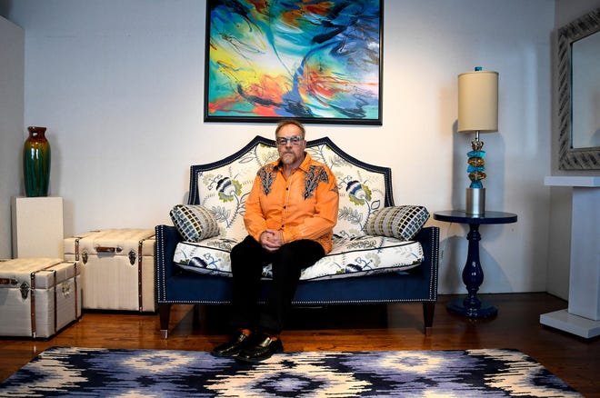 Michael J. Uvanni of Rome, N.Y., sits in one of his two interior design business showrooms in April 2017. Uvanni said his brother may have gotten more time from the many drugs he tried during his illness but that his quality of life was mostly terrible. (Mike Roy/for Kaiser Health News)