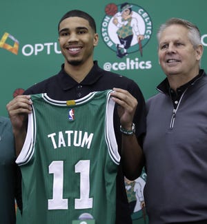 Celtics first-round draft pick Jayson Tatum stands with team president Danny Ainge Friday at the team's practice facility in Waltham, Mass. With Tatum, a 6-foot-8 small forward, the Celtics get a player who was a polished scoring threat during his lone season at Duke. [THE ASSOCIATED PRESS]