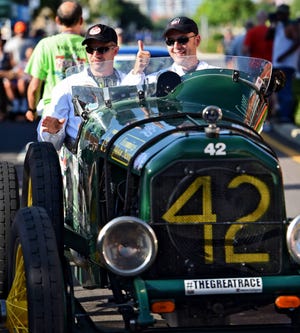 Davin Reckow (from left) waves as Jonathan Klinger gives a thumbs-up near the start of the race in their 1917 Peerless Speedster. On Saturday the Historic Springfield Main Street Cruise hosted the 34th annual Hemmings Motor News Great Race presented by Hagerty, with legendary drag racer “Big Daddy” Don Garlits flagging off the first of classic cars at the start line near 10th and N. Main St. The cross-country rally makes the fourth visit to Jacksonville for the national event and ends in Traverse City, Michigan. (Bob Mack/Florida Times-Union)