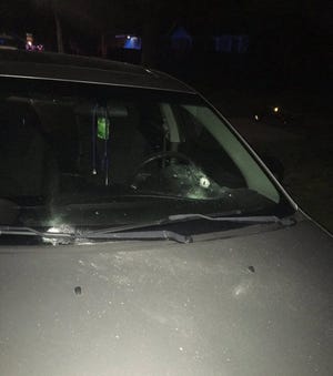 Jacksonville police said a man and woman inside this car were wounded in a barrage of gunfire at about 9:30 p.m. Friday outside a home in the 1900 block of West Durkee Drive. People were dropping off young children for a planned sleepover at the residence. (Jacksonville Sheriff’s Office/Provided)