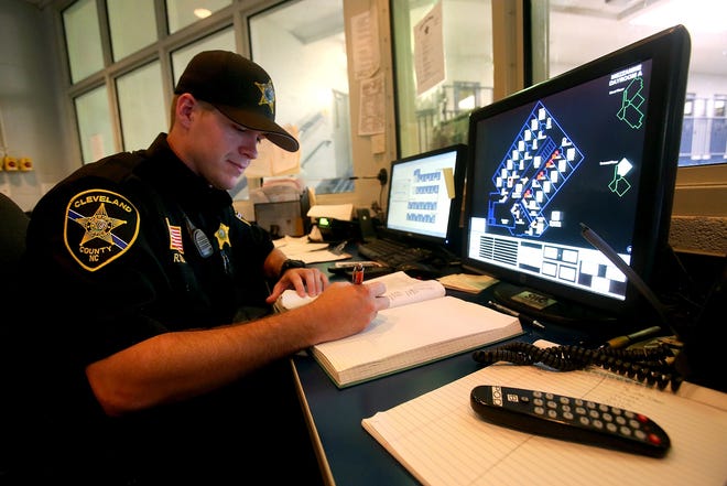 Officer Ricky Cody II works inside a control center at the Cleveland County Annex on Tuesday. [Brittany Randolph/The Star]