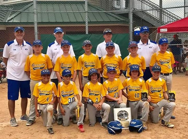 The GA Lightning 11U Baseball team from Evans recently won the "East Coast Summer Championship" baseball tournament in North Augusta. This faith-based team, with the motto, "Pray Hard, Work Hard, Play Hard," defeated the Mayhem, 10-0, in the championship. Justin Mayfield, pitcher of the GA Lightning, didn't allow one run in the championship. Pictured here are: (back row, from left) coaches Billy Kelley, Jack Davis, Chris Rutland, and Ryan Guy. Standing: Will McNeely, Justin Mayfield, Eric Doyon, Brayden Rutland, Caleb Ramsey and Amerson Guy. Kneeling: Nathan Nordeen, Alex Duncan, Jackson Denton, Hunter Carroll, Tucker Young, and Quinn Jackson.