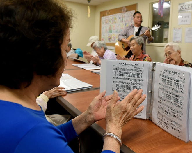 John Sung, of Cherry Hill, director and pastor of the Korean Community at the Mount Laurel Center for Rehabilitation and Healthcare, leads the residents in traditional Korean hymns on Friday, June 23, 2017.
